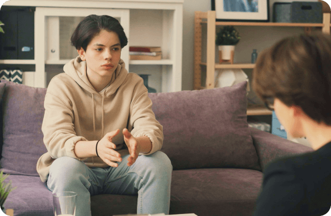 teenager sitting on a couch