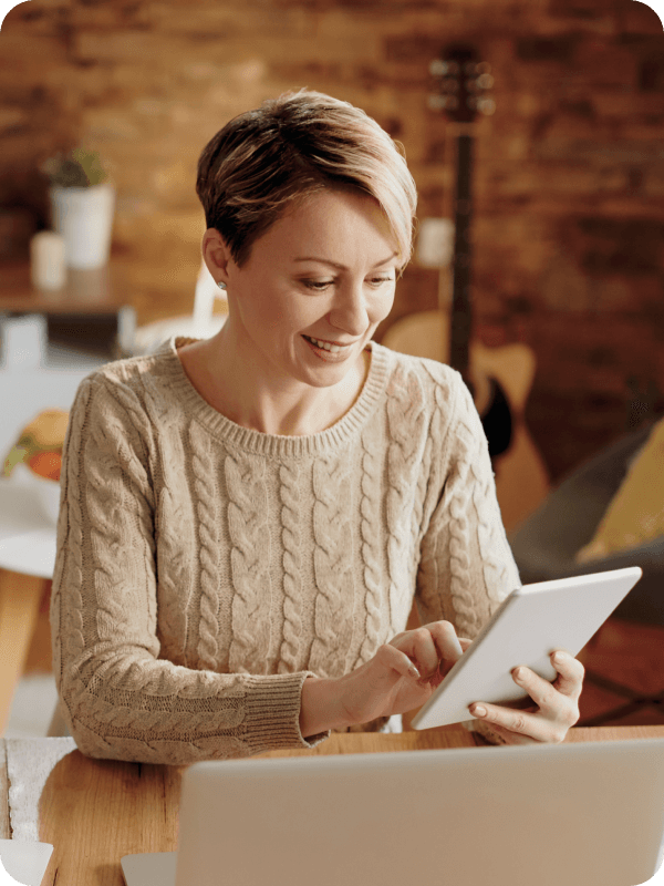 Woman looking at her tablet.