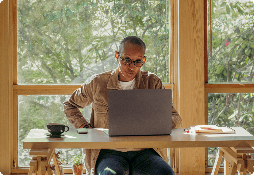 Person working at their desk, in a home office setup. 