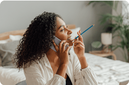 Woman talking on a phone.