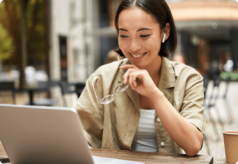 A woman working on her laptop.