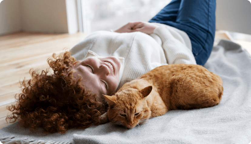 Lady with her cat looking at the ceiling