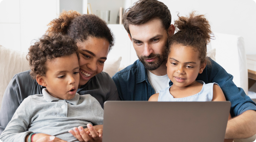Family looking at a laptop.