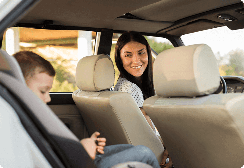 Mother bringing child to school in her insured car