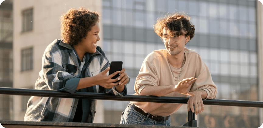 2 persons talking outside