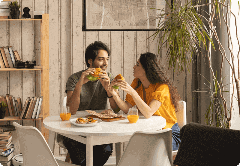 Couple eating in their home.