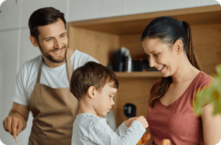 Parents playing with their child.