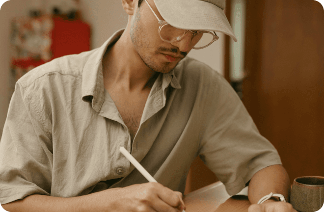 Man writing on his desk