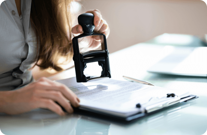 a stamp close to some papers