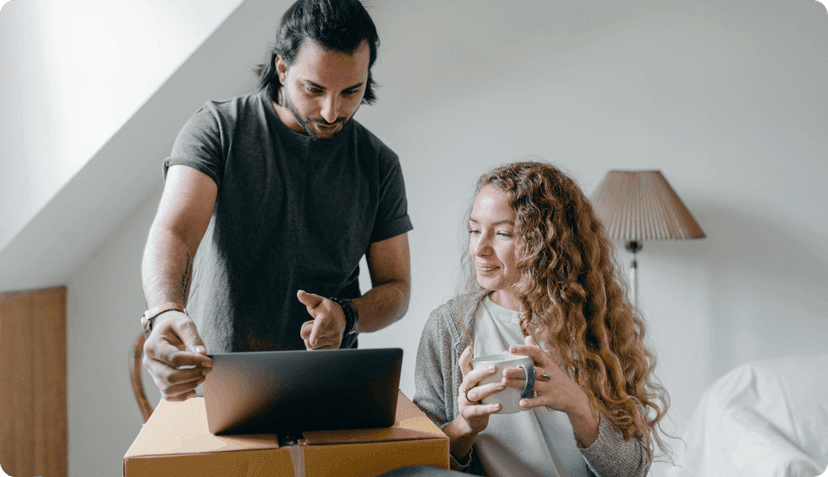 A couple checking policies online.