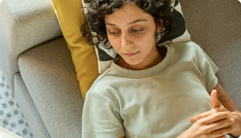 Person laying on a couch.