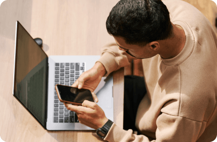 A person looking for a private health insurance for expats on their phone in Slovenia.