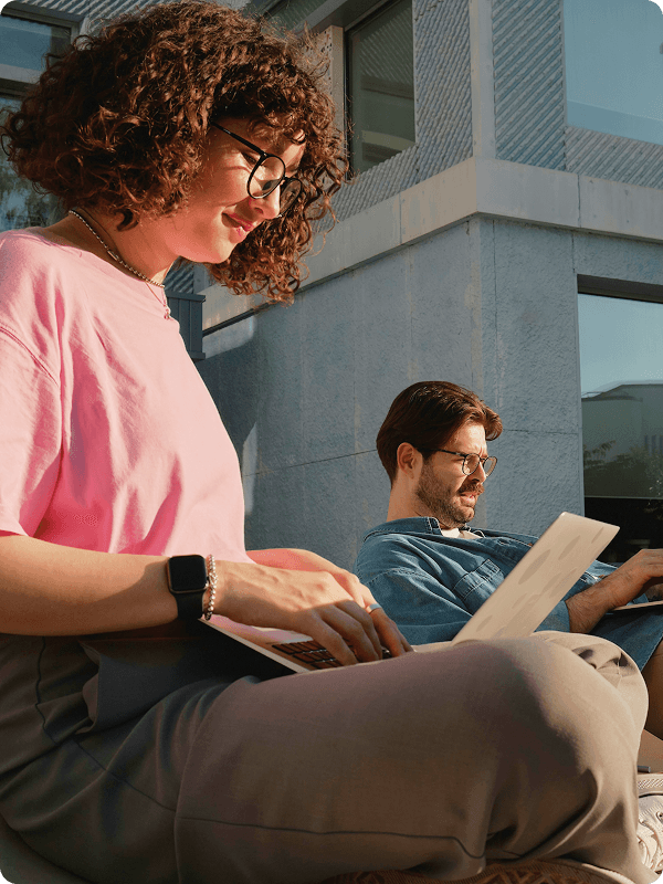 Students working on laptops.