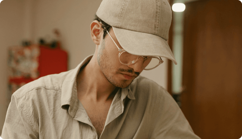 A man sitting and working on his laptop.