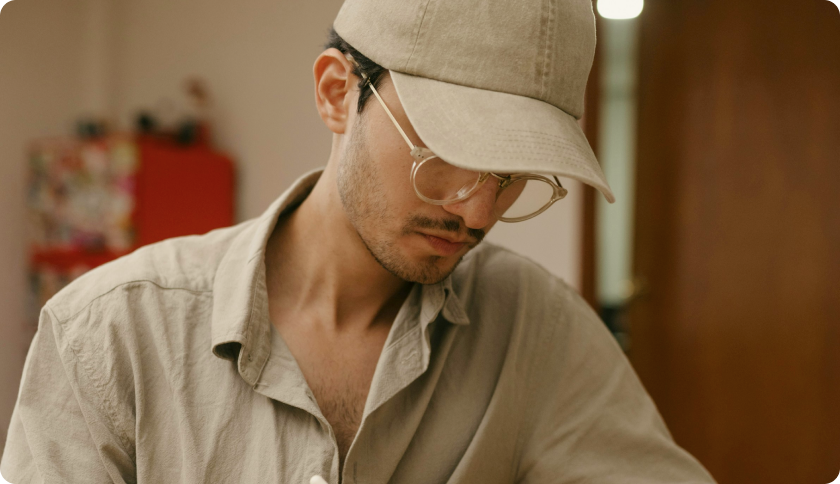 A man sitting and working on his laptop.