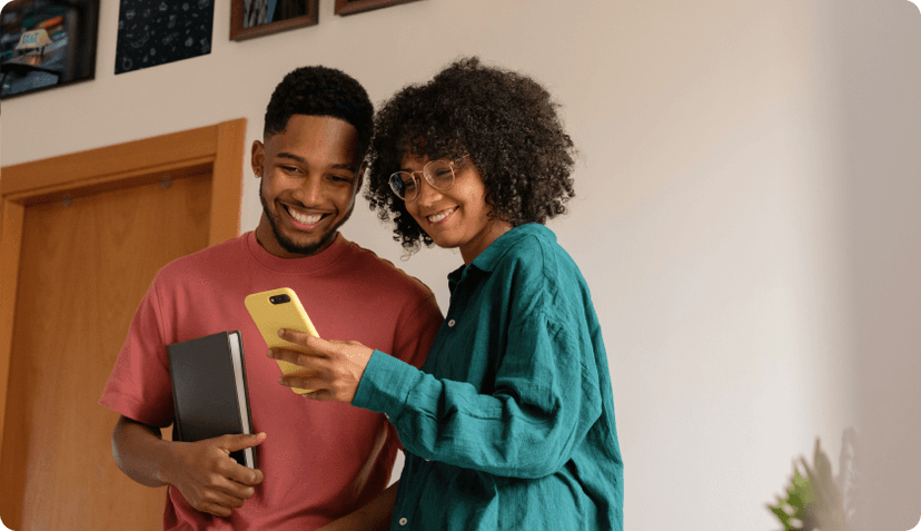 A couple living in the Netherlands checking their health insurance on their phone.