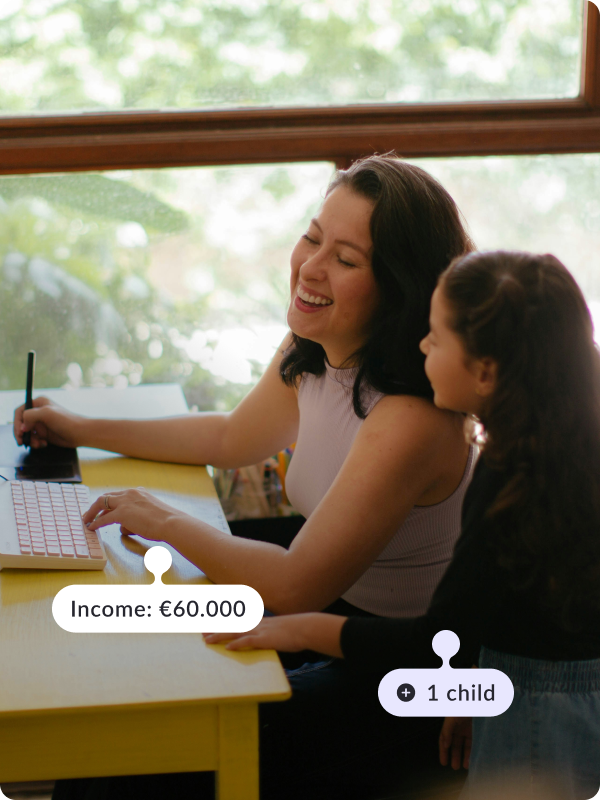 Woman working at home at her desk, in front of computer with her daughter standing by her side. The tags read "Income: €80.000" and "1 child".