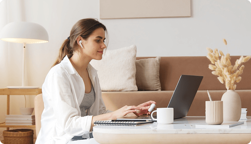 Woman looking at laptop.